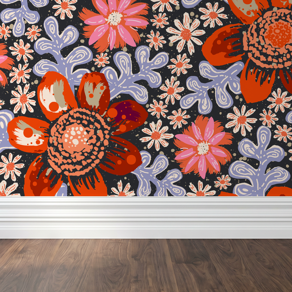 Bold floral wallpaper with red and pink flowers on black background in room setting.