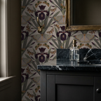 Botanical wallpaper with Dutch iris and moths on beige in elegant bathroom.