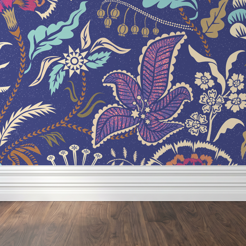 Floral wallpaper with pink, cream, and indigo motifs on ultramarine background in room setting.
