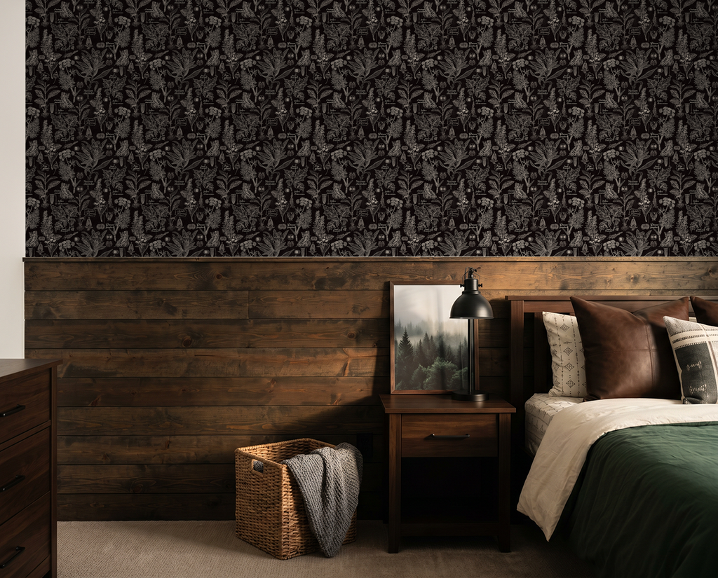 Charcoal botanical wallpaper in rustic bedroom with dark wood accents.