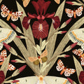 Charcoal wallpaper with burgundy irises and moths in a botanical pattern.