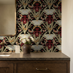 Charcoal and burgundy wallpaper with red irises and moths in a bathroom setting.