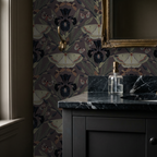 Dark floral and moth wallpaper in elegant bathroom with marble sink.