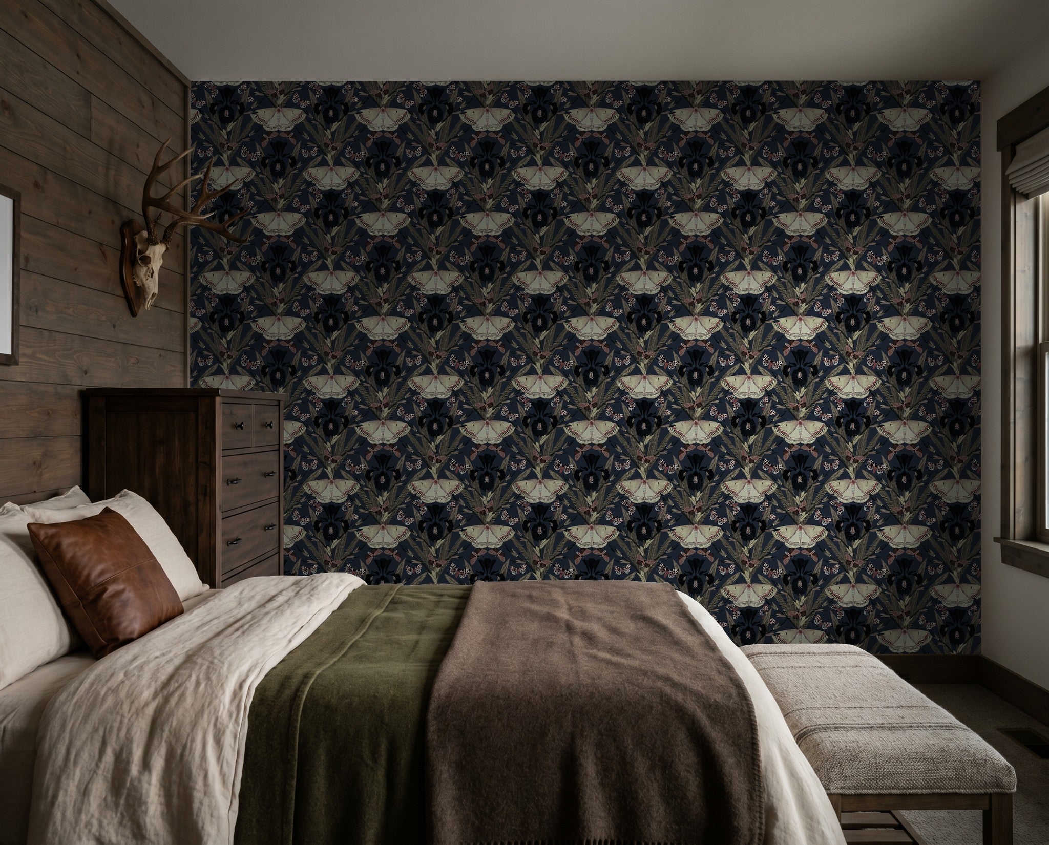 Bedroom with Dutch Iris flower and moth wallpaper in navy, maroon, and cream tones.