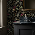 Floral botanical wallpaper in black with pink and green motifs in elegant bathroom.