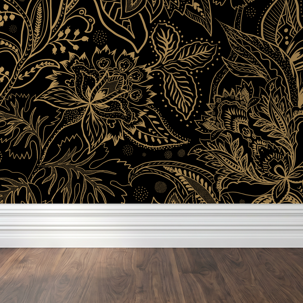Gold floral paisley wallpaper on black background with wood floor