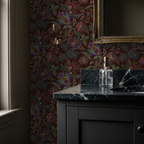 Jacobian floral wallpaper with emerald and burgundy tones in a bathroom setting.