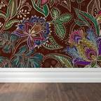 Jacobian floral wallpaper with emerald, burgundy, and red motifs on a rich rust background.