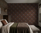 Jacobian Floral wallpaper in emerald, burgundy, and red in a rustic bedroom setting.