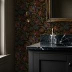 Jacobian floral wallpaper with jewel-toned flowers in elegant bathroom setting.