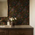 Jacobian floral wallpaper with jewel-toned flowers in a bathroom setting.