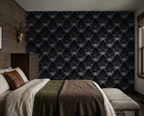 Moody floral wallpaper with Dutch irises and moths in a rustic bedroom setting.