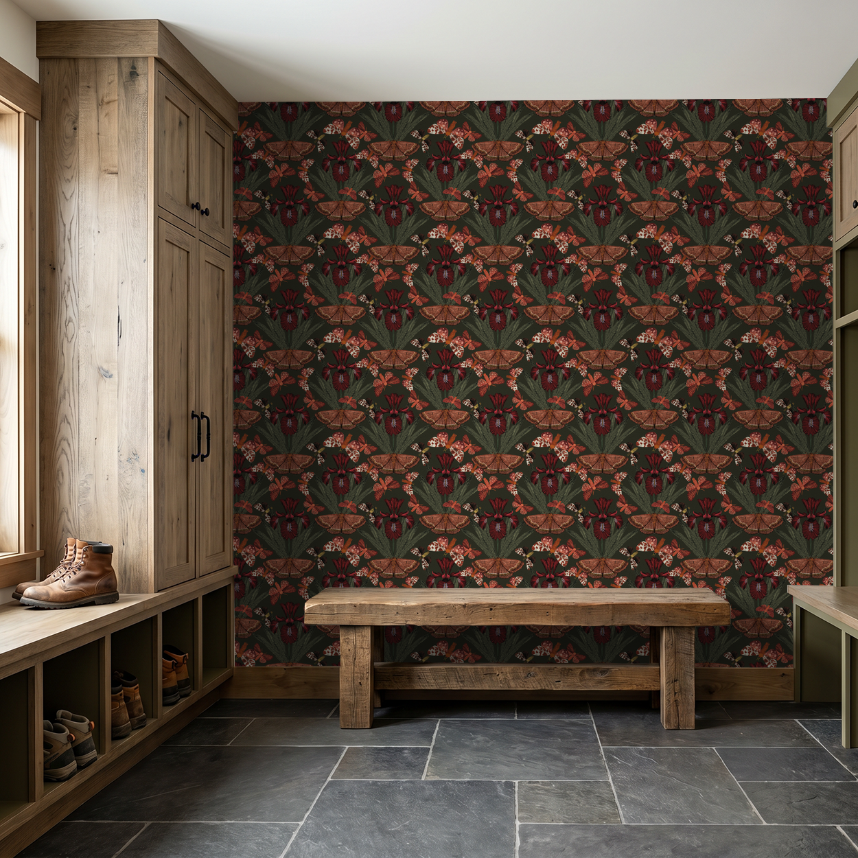 Moody jewel-toned wallpaper with ruby and terracotta moths, olive foliage in rustic room.