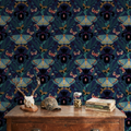 Moody navy wallpaper with moths and irises in a rustic room setting.