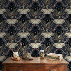 Moth and iris floral wallpaper in dark tones with vintage decor setting.