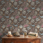 Muted blue and taupe chintz floral wallpaper in a rustic room setting.