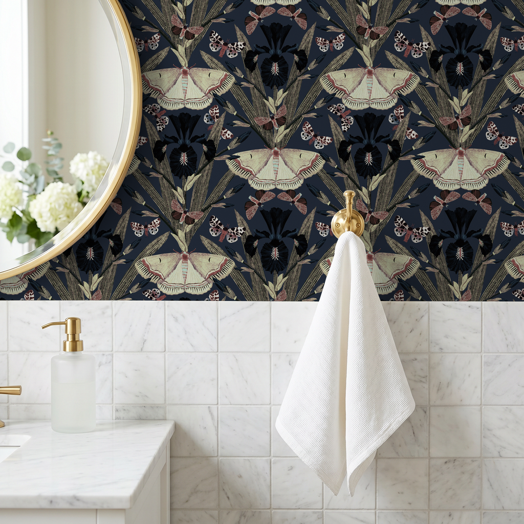 Navy wallpaper with moth and iris design in elegant bathroom setting.