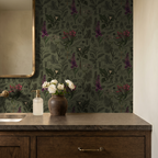 Olive and charcoal botanical wallpaper with floral illustrations in a bathroom setting.