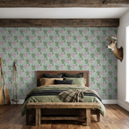 Teal and peach dragon wallpaper in rustic bedroom with wooden furniture.