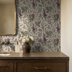 Vintage botanical wallpaper with purple and green plants in a rustic bathroom setting.