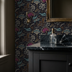 Vintage floral wallpaper with teal, gold, and magenta design in bathroom setting.