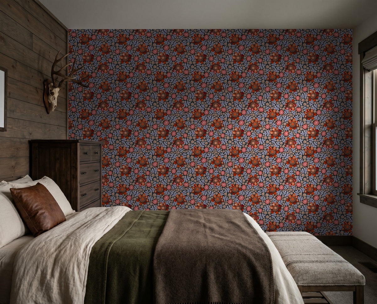 Bedroom with whimsical floral wallpaper featuring red and coral flowers on a dark background.